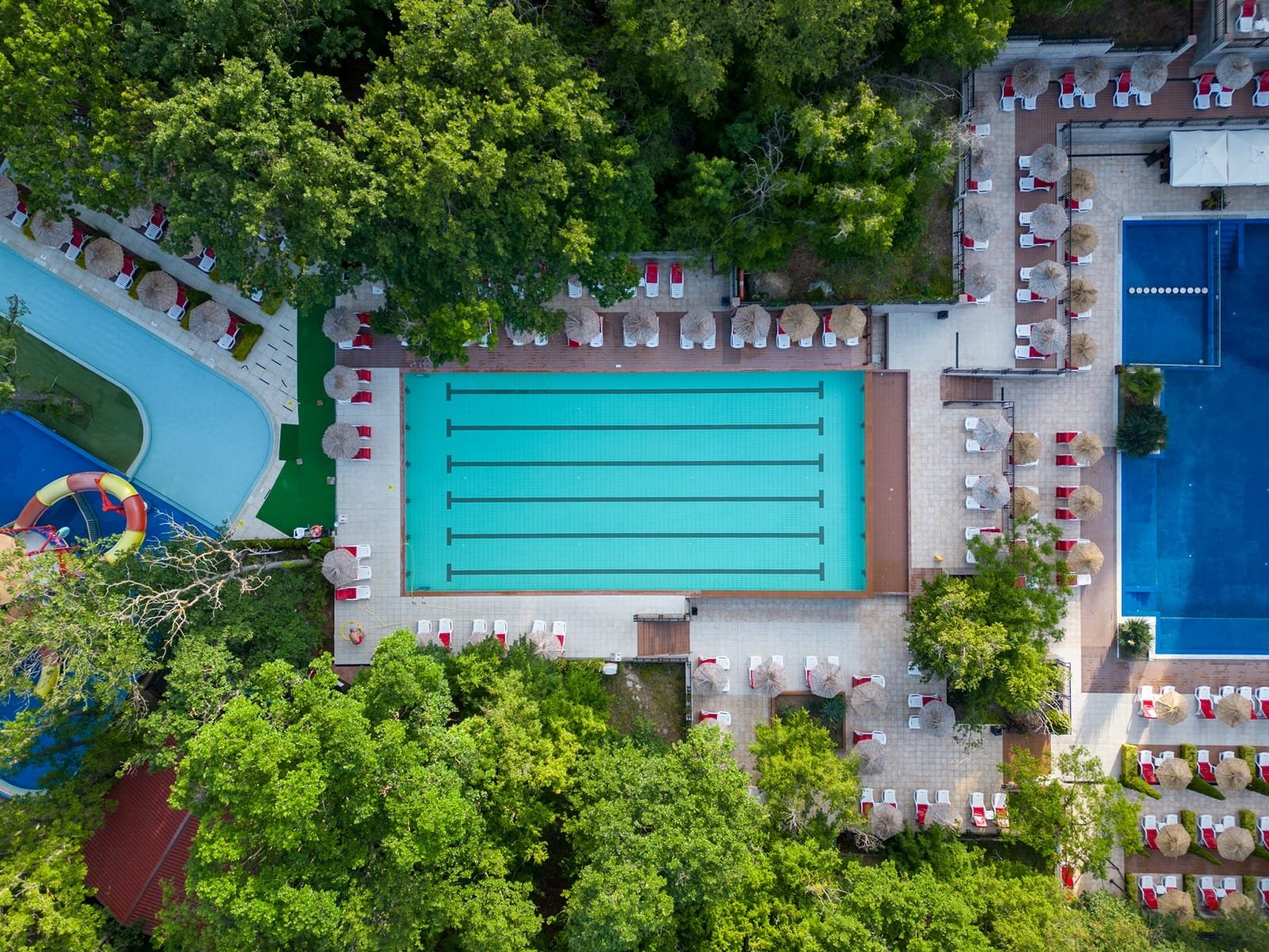 Aerial top view of beautiful luxury outdoor swimming pool in hotel resort